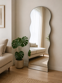 Doremon bubble-arch standing mirror leaning on bedroom wall — Bask Decor Pakistan