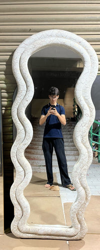 Onde sculptural wavy standing mirror in bedroom — Bask Decor Pakistan