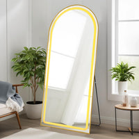 Aura arched LED floor mirror glowing in bedroom — Bask Decor Pakistan
